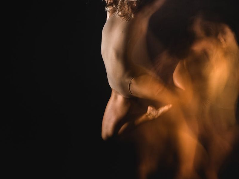 Bright yellow light accents in a dark fitness studio